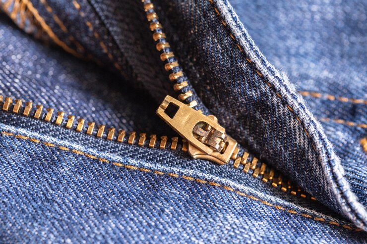Fondo de textura de tela de mezclilla jeans con cremallera para el diseño