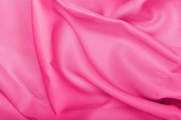 Fondo de textura de tela de seda rosa