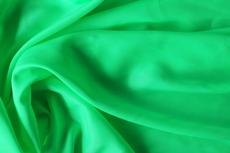 Foto fondo de textura de tela verde, fondo de tela arrugada con ondas suaves