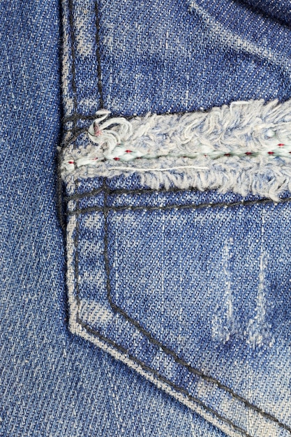 Fondo texturizado de los pantalones vaqueros azules del bolsillo.