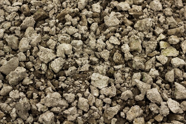 Fondo de tierra secada de la textura del suelo agrietado de la tierra.