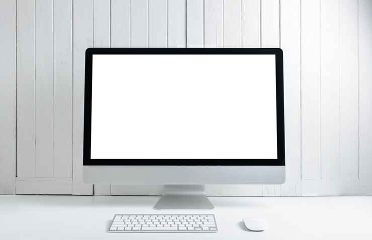 Foto fondo de trabajo con la computadora de escritorio moderna en blanco de la pantalla en blanco.