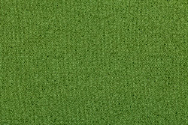 Foto fondo verde de un material textil con patrón, primer plano. estructura de la tela con textura natural.