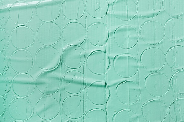 Fondo verde pastel decorativo con patrón redondo, espacio libre. Textura de yeso húmedo, diseño de estuco, concepto de reparación