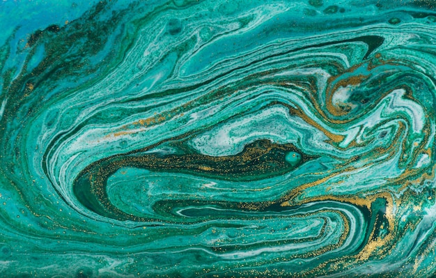 Fondo veteado verde y oro. Textura líquida de mármol polvo de oro.