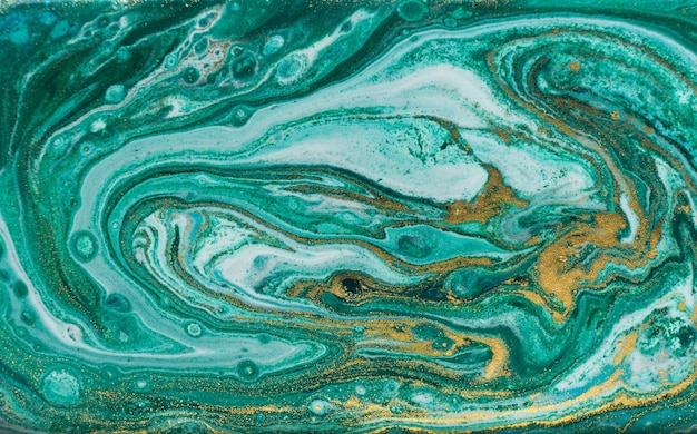 Fondo veteado verde y oro. Textura líquida de mármol polvo de oro.