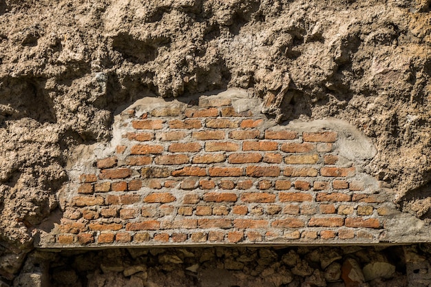 El fondo de la vieja pared de ladrillo grunge