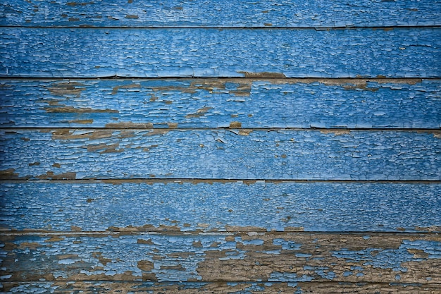 Fondo vintage abstracto de pintura azul, superficie de pelado de madera vieja