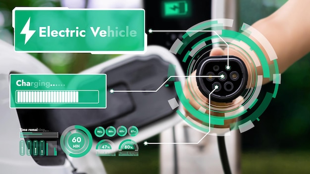Foque a mão apontando o carregador EV na frente da câmera, exibindo o holograma de status da bateria inteligente em fundo desfocado Carregador de carro elétrico usando energia limpa, reduzindo a emissão de CO2Peruse