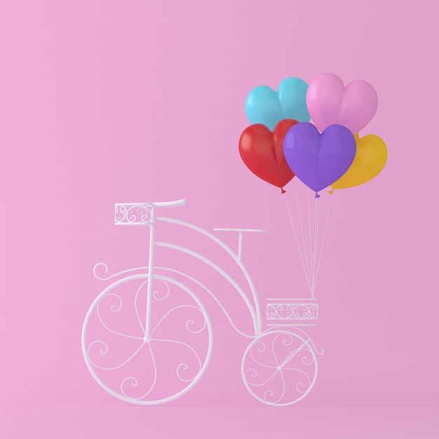 La forma colorida del corazón del globo cuelga el vintage blanco de la bicicleta en fondo rosado. co mínimo