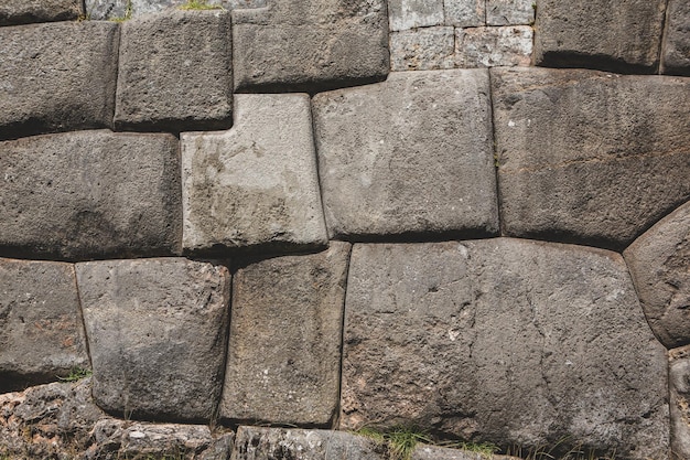 Fortaleza de Sacsayhuaman en Cusco Perú o fondo de pared de piedra