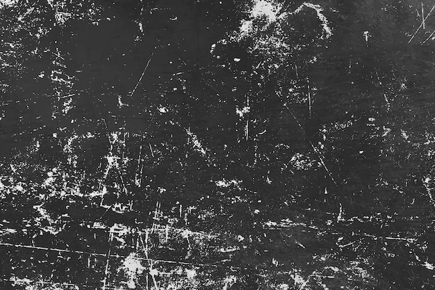 Una foto en blanco y negro de una pared sucia con una mota blanca.