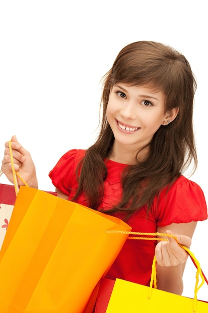 Foto foto de adolescente com sacolas de compras