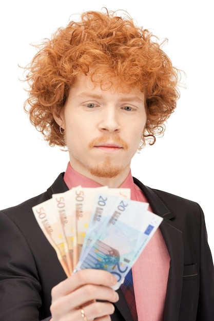 foto de homem bonito com dinheiro em euros