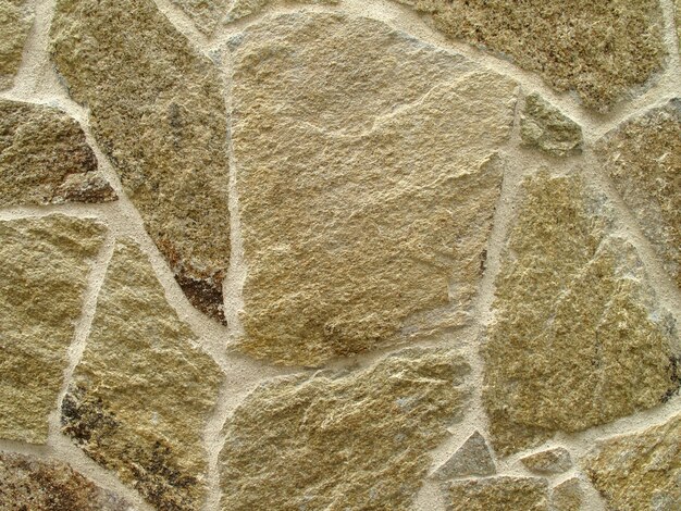 Foto de uma parede de pedra lisa para o fundo