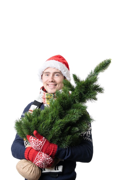 Foto foto eines mannes mit weihnachtsbaum mit weihnachtsmütze