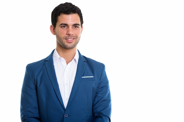 Foto de estudio de joven empresario hispano feliz sonriendo