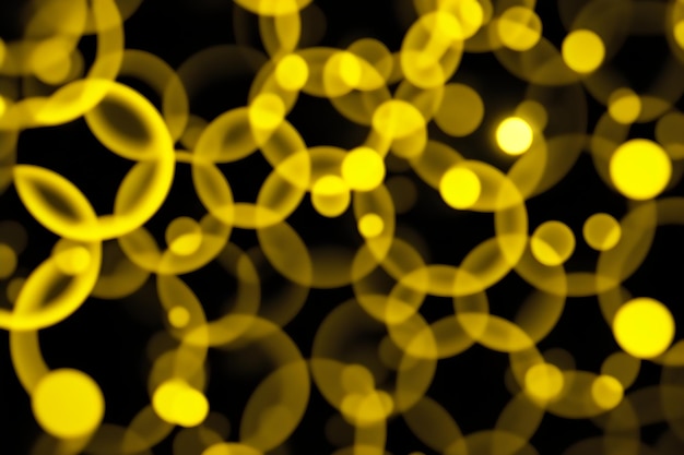 Foto fundo panorâmico escuro bokeh amarelo brilhante círculos brilhantes onda abstrata