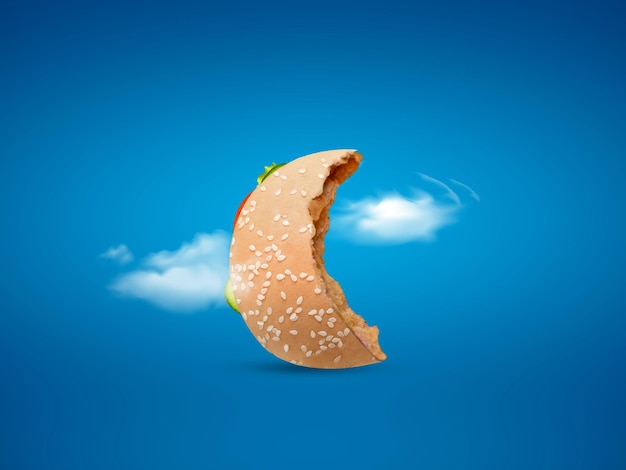 Foto hamburguesa con forma de luna sobre fondo azul feliz ramadán feliz eid concepto