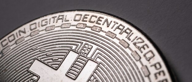 Foto de una moneda criptográfica Bit Coin