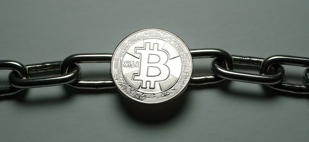 Foto de una moneda criptográfica Bit Coin