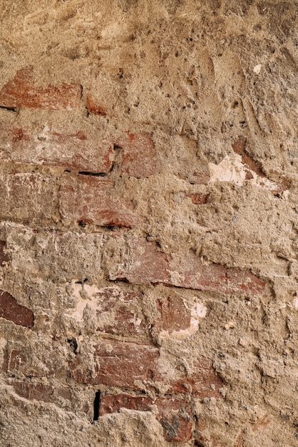 foto vertical de uma parede de tijolos em fundo de textura de cimento foto de alta qualidade