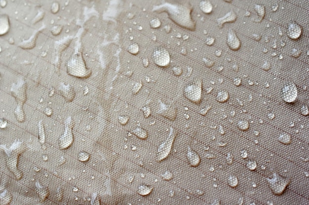 Fotografia completa de gotas de água no tecido