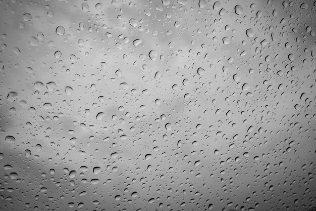 Foto fotografia completa de gotas de chuva em uma janela de vidro