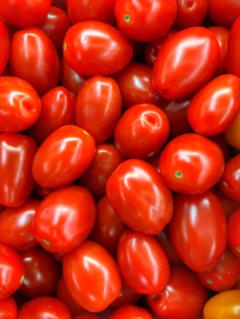 Foto fotografia completa de tomates para venda no mercado