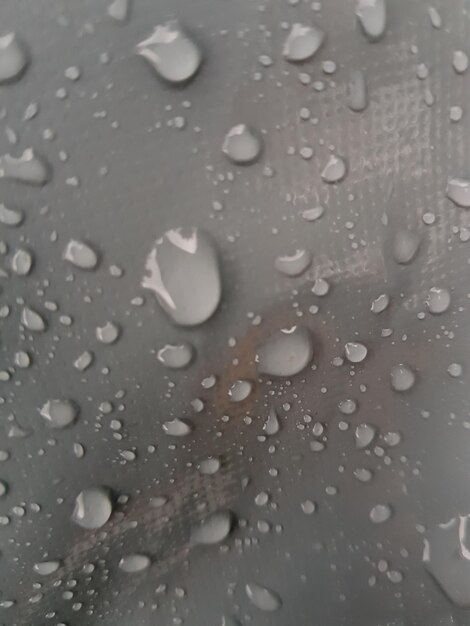 Foto fotografía completa de las gotas de lluvia en una ventana de vidrio