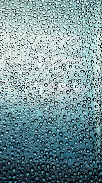 Foto fotografía completa de las gotas de lluvia en una ventana de vidrio