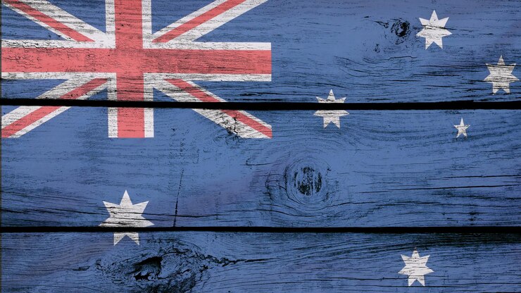 Foto fotografia em close-up da bandeira australiana em um fundo de madeira