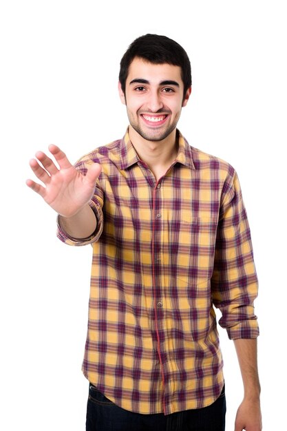 Foto fotografía de estudio de un joven extendiendo la mano para un apretón de manos aislado en blanco