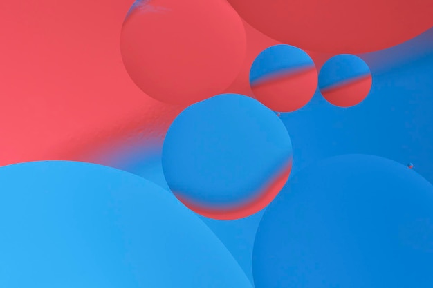 Fotografía macro con círculos gotas de aceite superficie del agua Fondo azul y rojo abstracto con burbujas de aceite