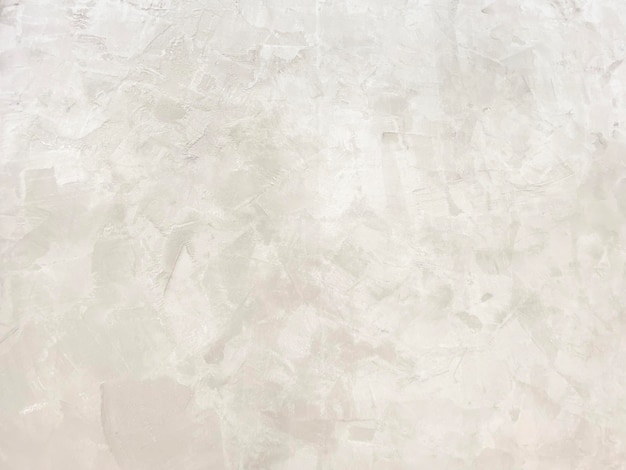 Fotografía de una pared de cemento de color claro con un patrón pulido natural con capas superpuestas de color que crean dimensiones naturales