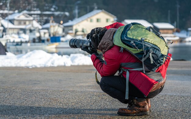 Fotógrafo com cenário de inverno