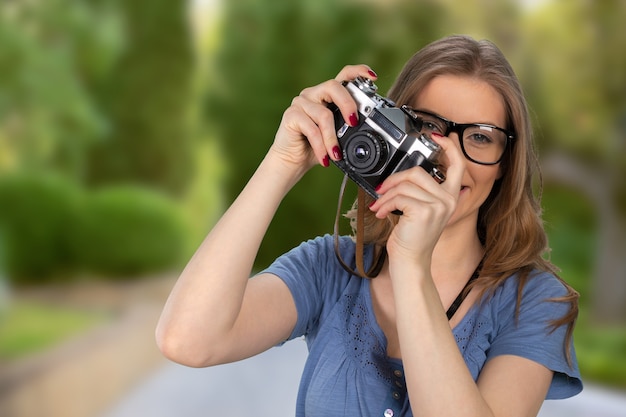 Fotógrafo de mujer con cámara