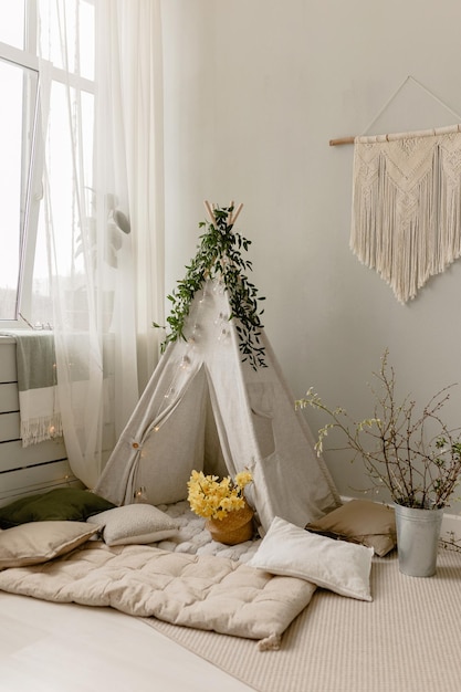 Fotozone für Frühlingskinder mit einem Wigwam Kinderinterieur Hasen Wigwam Frühlingszweige p