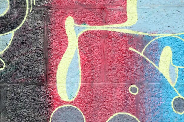 Fragment von Graffiti-Zeichnungen Die alte Wand, die mit Farbflecken im Stil der Street-Art-Kultur dekoriert ist Mehrfarbige Hintergrundtextur