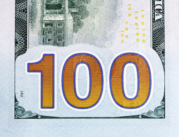 Foto fragmento de billete de cien dólares número 100 closwup nueva edición
