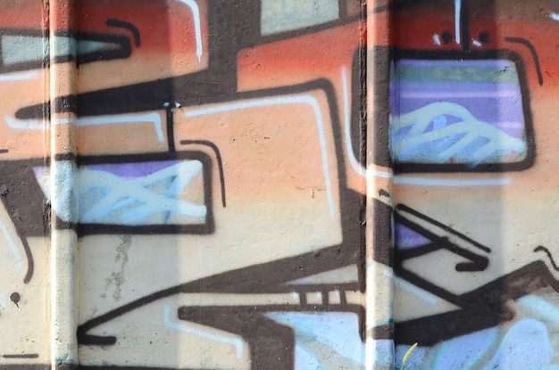 Fragmento de dibujos de graffiti El antiguo muro decorado con manchas de pintura al estilo de la cultura del arte callejero Textura de fondo coloreada en tonos cálidos