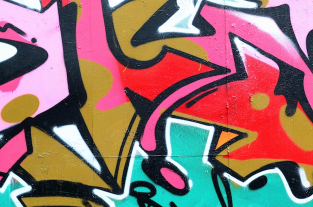 Fragmento de un hermoso patrón de graffiti en rosa y verde con un contorno negro Imagen de fondo de arte callejero