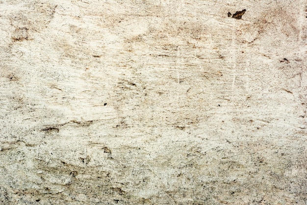 Foto fragmento de pared con arañazos y grietas.