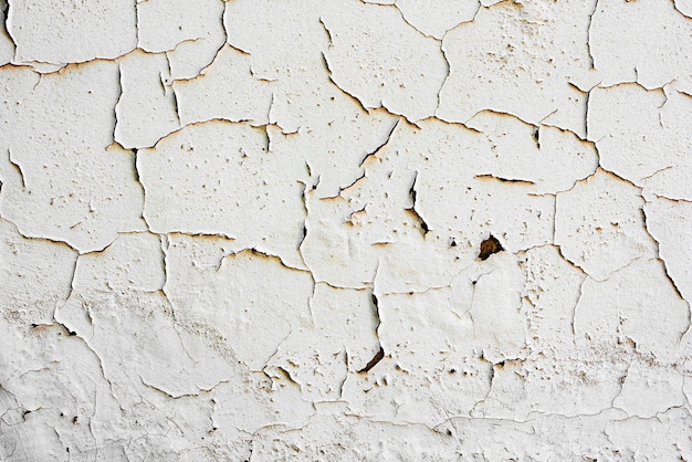 Foto fragmento de pared con arañazos y grietas.