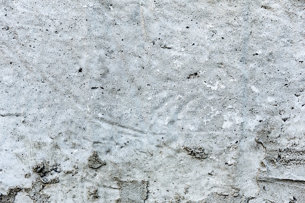 Fragmento de pared con arañazos y grietas