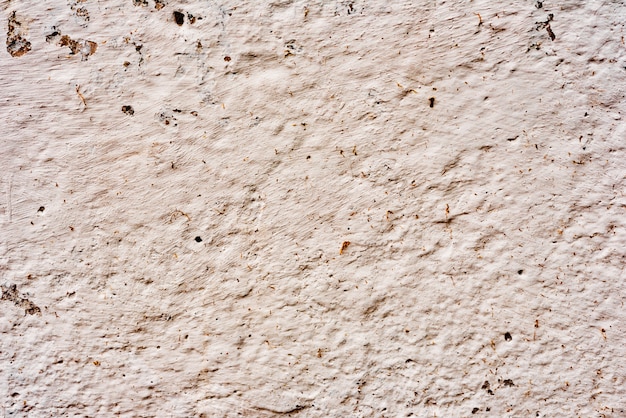 Foto fragmento de pared con rasguños y grietas.