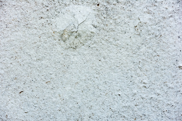 Foto fragmento de pared con rasguños y grietas.