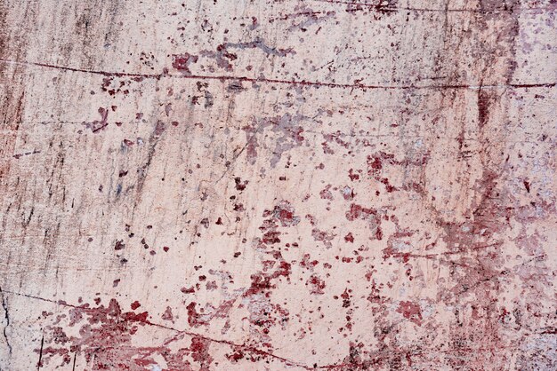 Foto fragmento de pared con rasguños y grietas.