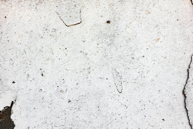 Foto fragmento de pared con rasguños y grietas.