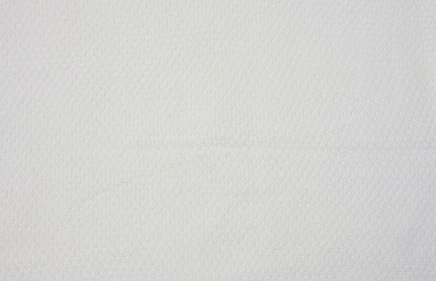 Fragmento de un suéter de punto blanco